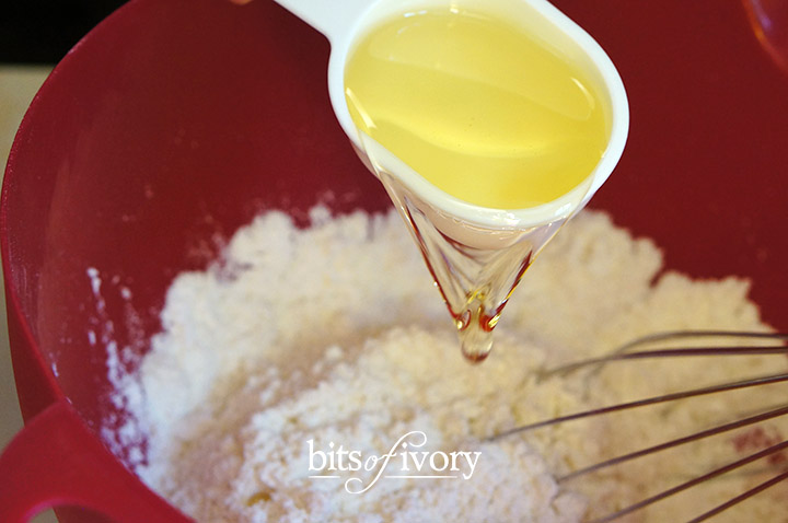 Pouring oil in the dry ingredients - Venezuelan Corn Cakes - Arepas
